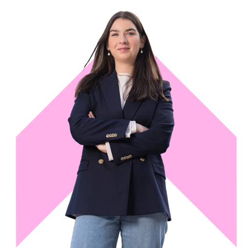 A person with arms crossed with pink chevron background