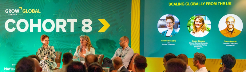 A panel of three speaking to a crowd of people with green background with the words Grow London Global Cohort 8 written on it, alongside profile pictures and job descriptions of the three panellists.