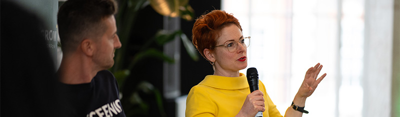 Two speakers at a business event.