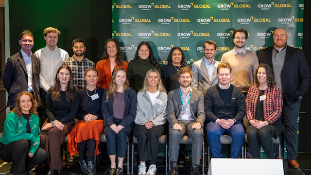 Team of Grow London Global programme lined for a group picture in front of a green board with Grow London Global written all over it.