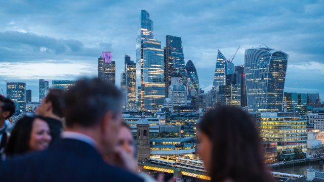 corporate event takes place with London city skyline in background