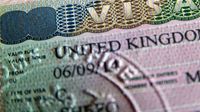 A close up of a passport page with the words "visa United Kingdom" printed.