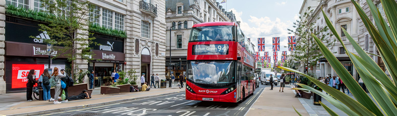 A red double decker London bus on Regent Street.