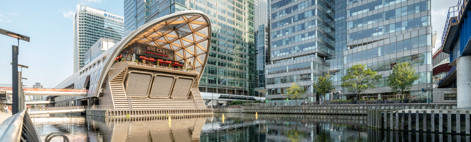 A trendy street food eatery among the modern buildings in Canary Wharf, London.
