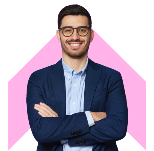 A smiling man in a navy blue suit and light blue shirt with a pink chevron in the background.