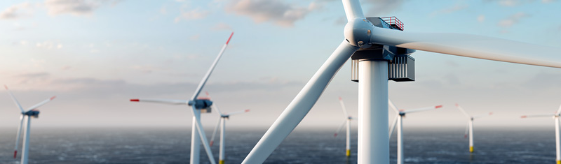 An aerial view of several wind turbines