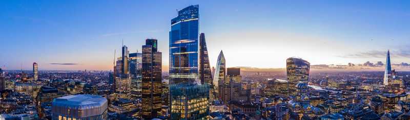 A view of a sunset with the city of London in the foregound