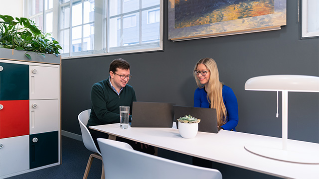 Two colleagues in an office meeting at London & Partners.